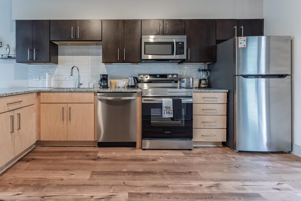 Modern kitchen with stainless steel appliances and spacious countertops
