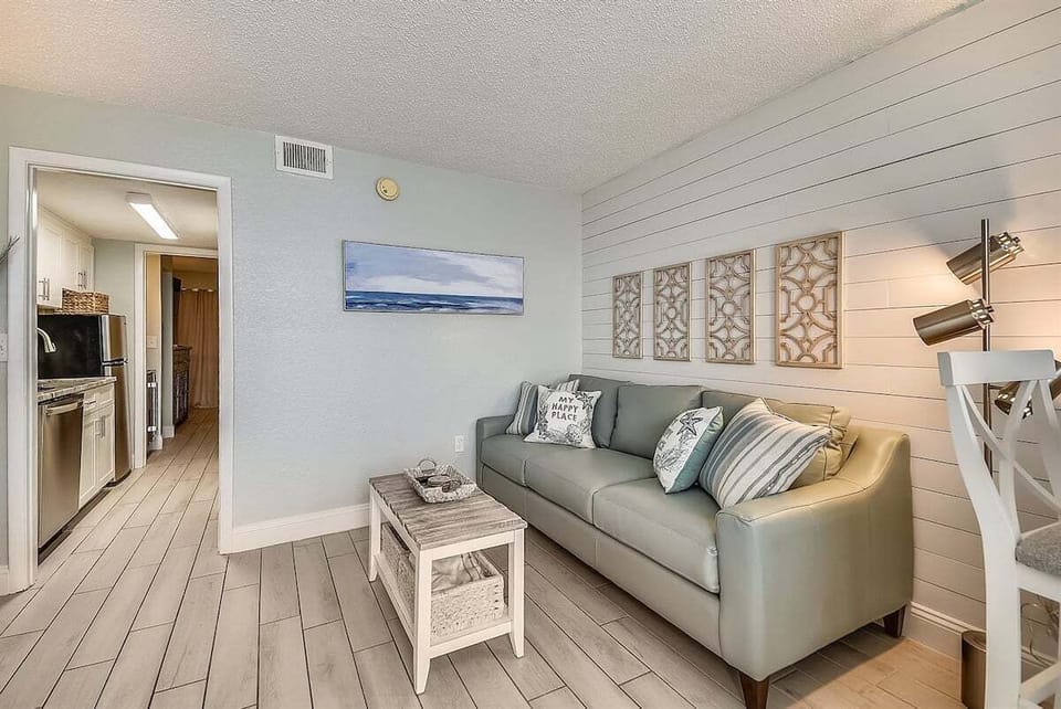 The living area flows easily toward the kitchen for relaxed, everyday living.