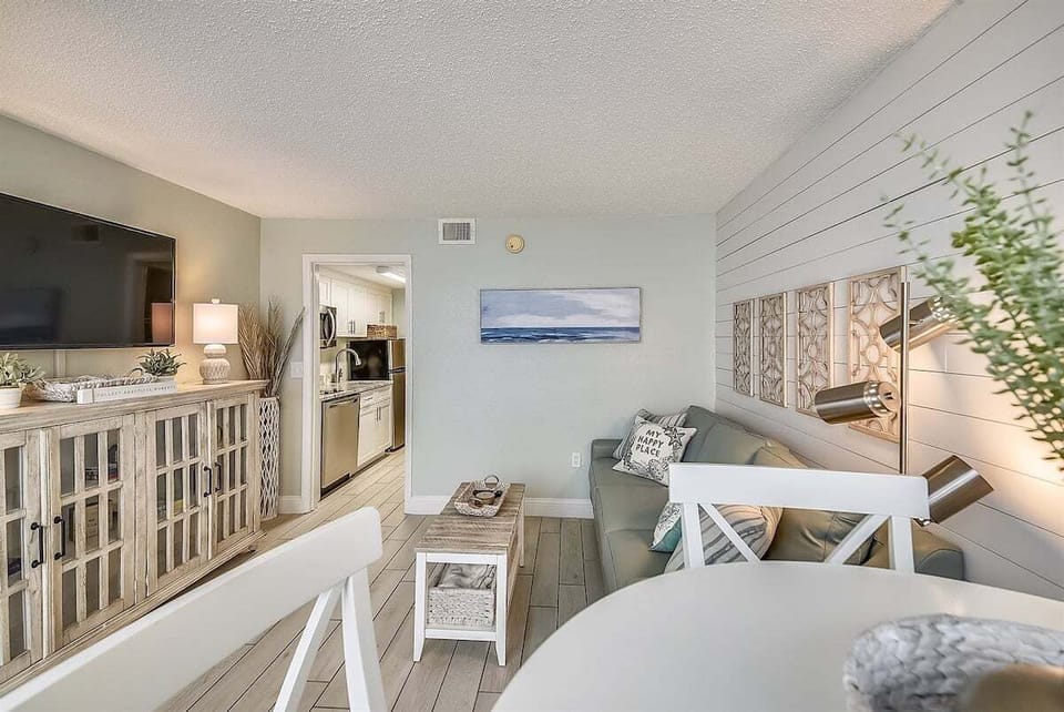 The open layout keeps the kitchen, dining, and seating areas comfortably connected.