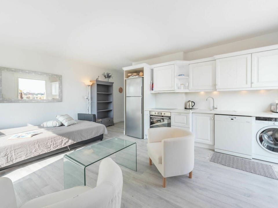 Furniture, Cabinetry, Couch, Living Room, Comfort, Floor, Home Appliance, Kitchen Appliance, Flooring