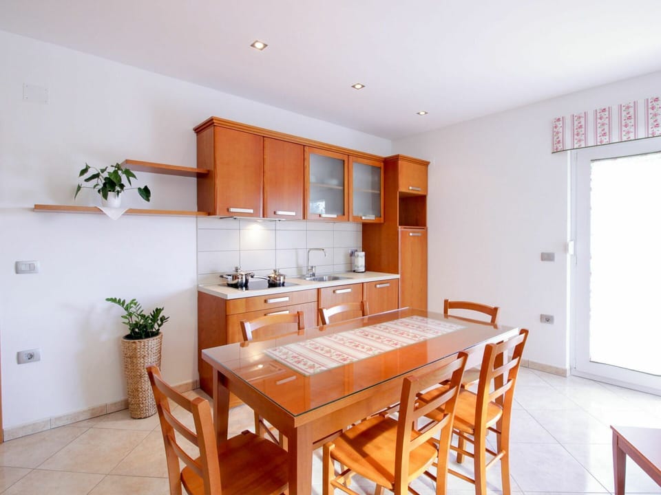 Table, Cabinetry, Furniture, Property, Countertop, Plant, Chair, Wood, Kitchen, Orange
