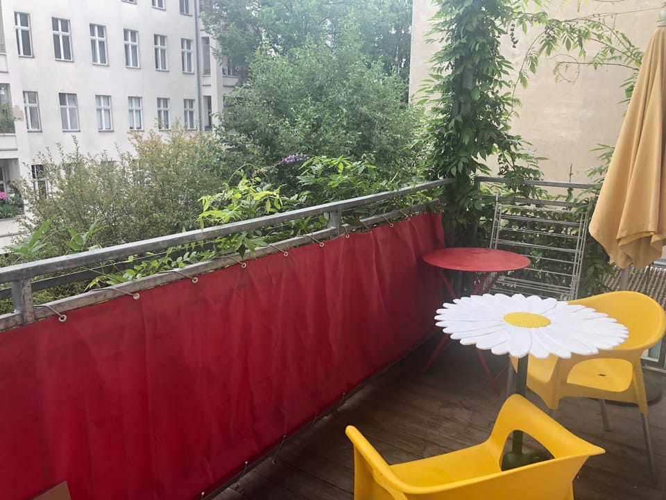 quiet balcony facing green backyard