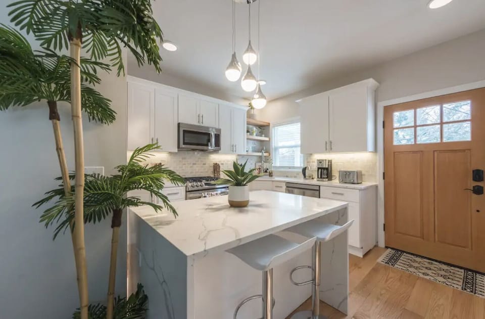 Brand-new kitchen and island table with seating for two.

