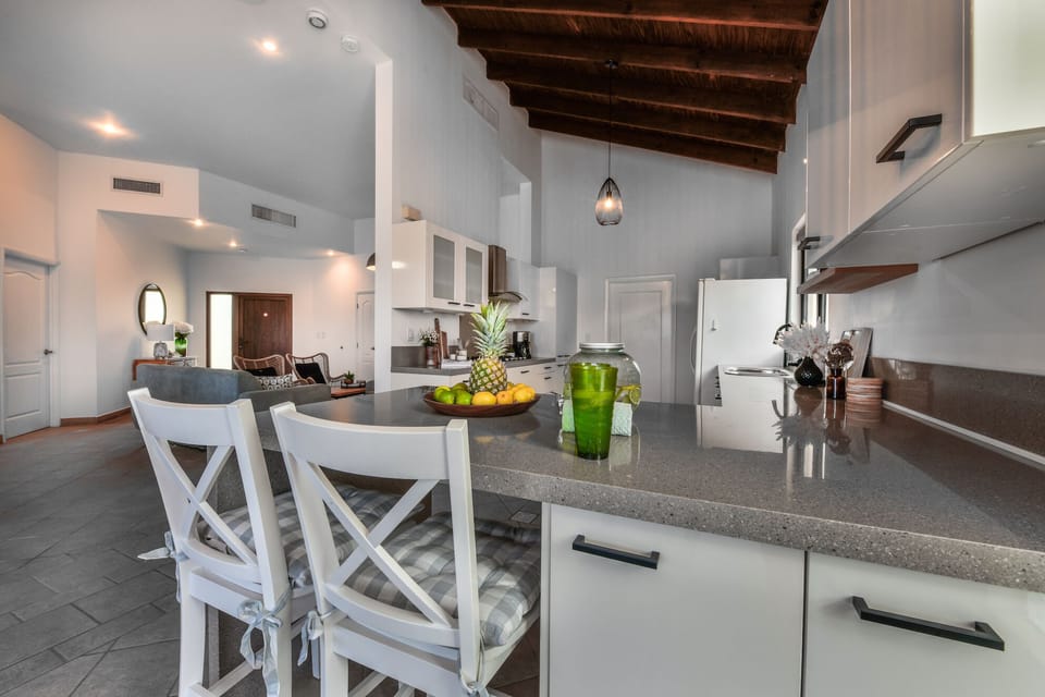 Enjoy casual dining at our sleek breakfast bar, a convenient spot for meals throughout the day.