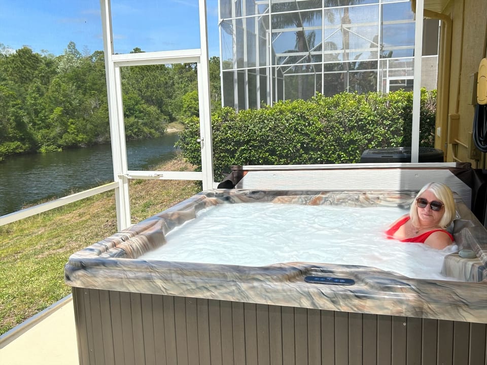 Hot tub overlooking preserve and water