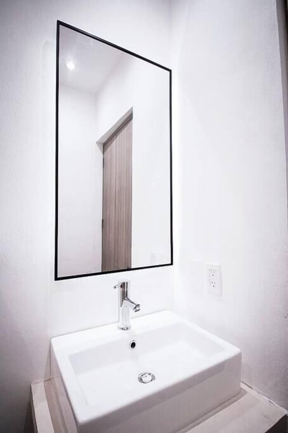 Mirror above a sink for your convenience