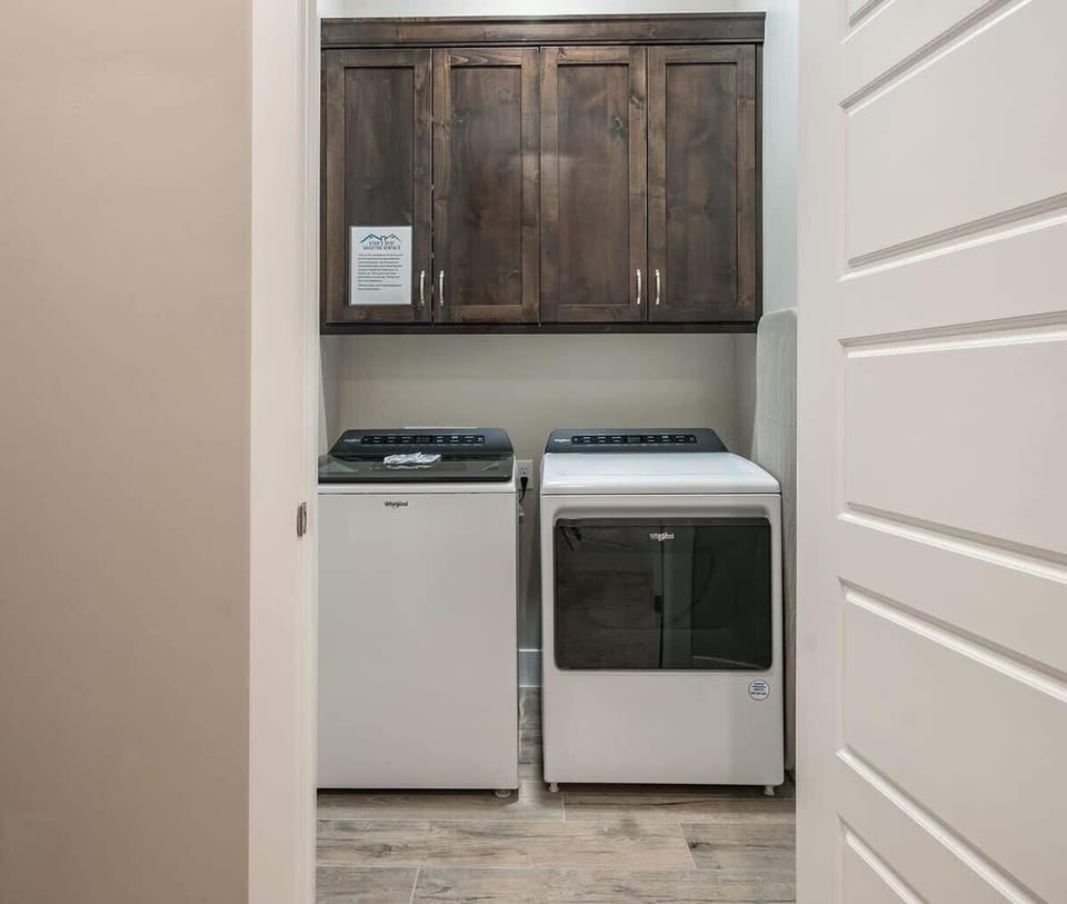 Laundry room with washer and dryer provided