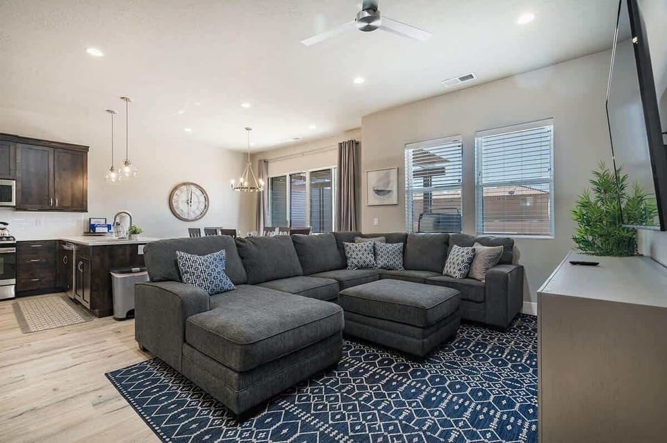 House #51 family room with comfortable sectional and TV