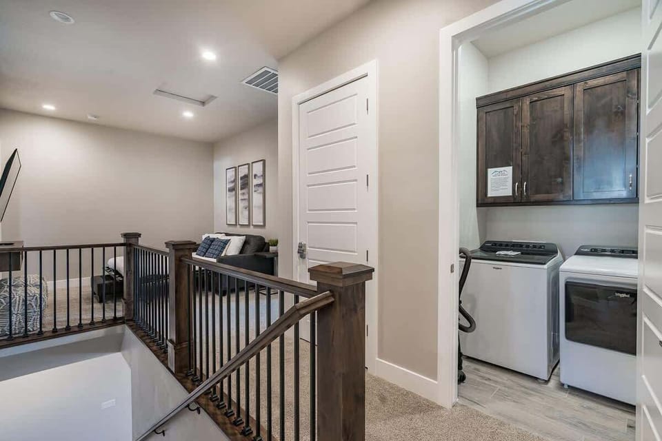 House #50 upstairs family room and laundry room