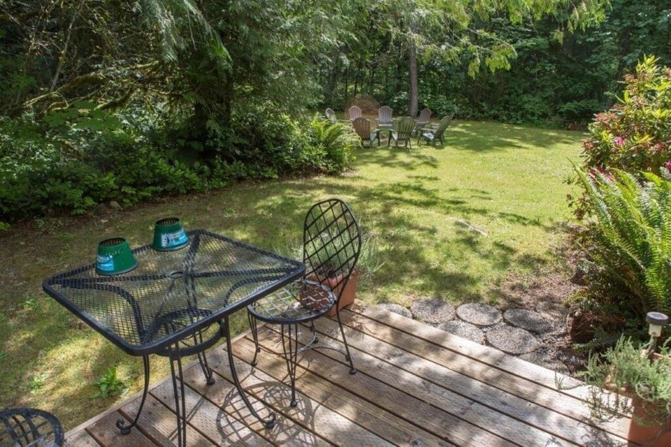 Back deck with seating and outdoor firepit area