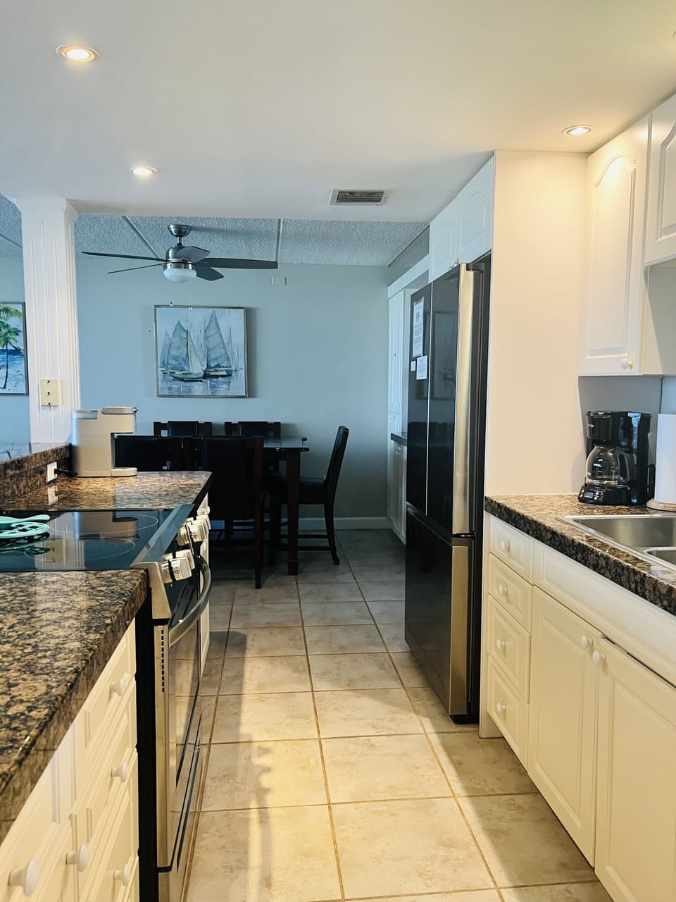 Stocked kitchen with upgraded fridge (with ice maker), and oven range