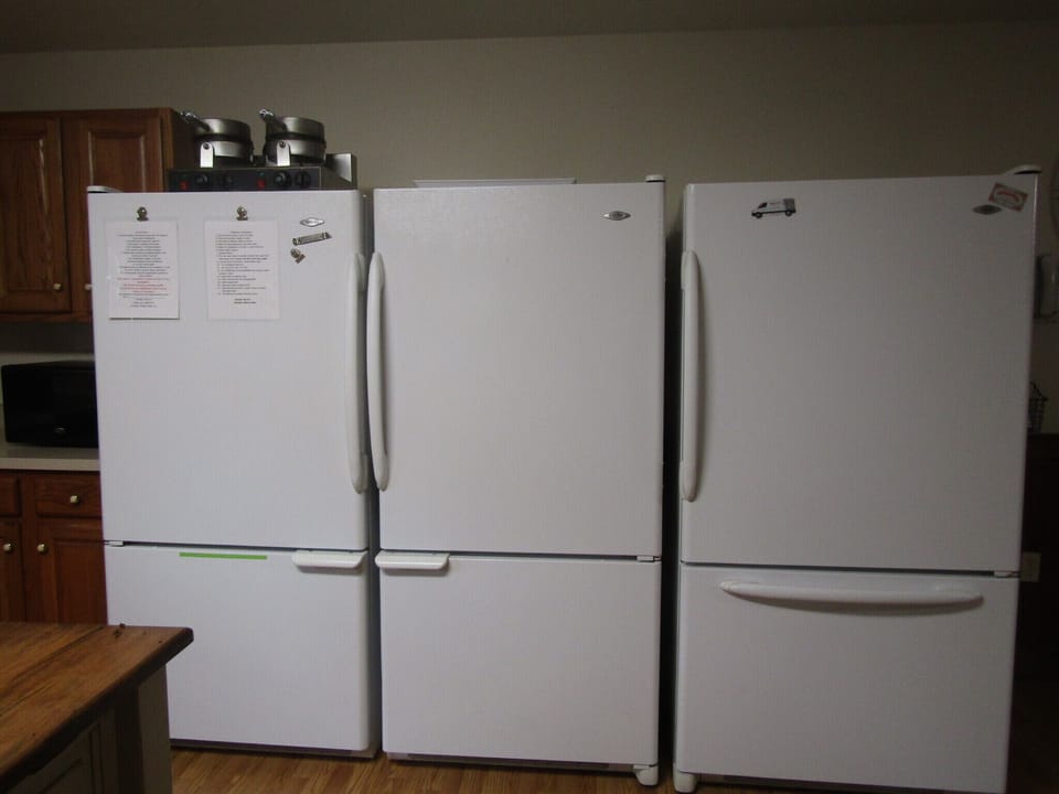 3 fridges with freezers