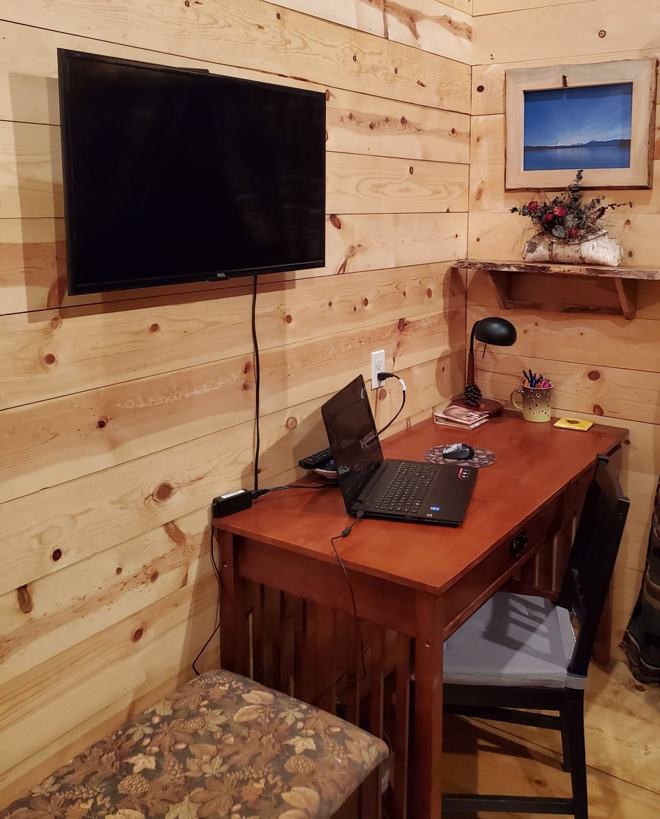workspace and roku tv in guest bedroom 