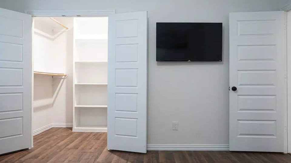 Spacious closet and TV in this bedroom.
