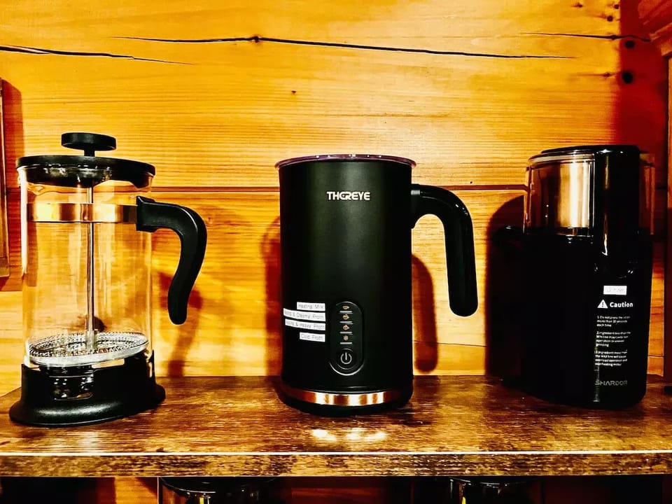 French Press, Milk Frother, Bean Grinder at our Coffee Bar