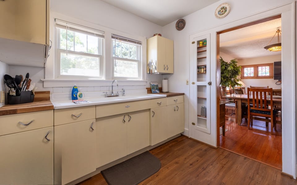 Bright kitchen leading to dining room