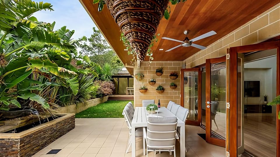 Sheltered alfresco dining for 8 people.