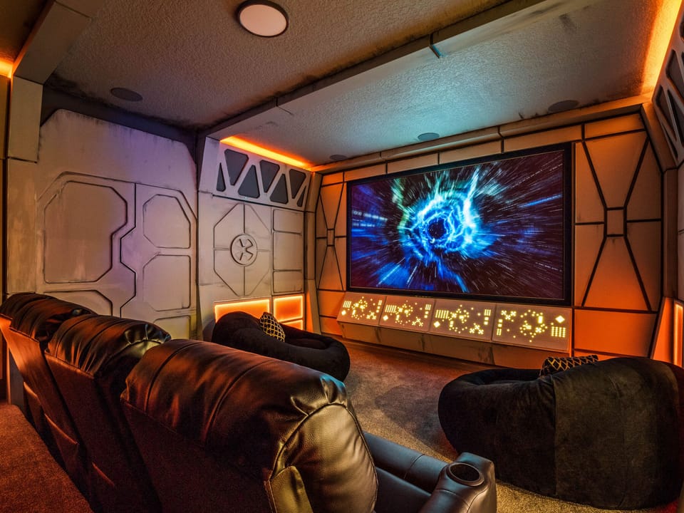 - Private home theater with leather recliners and glowing lights  
- Huge screen for immersive movies and family entertainment  
- Orlando villa with cinematic experience for your group stay