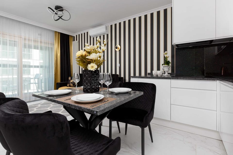 Kitchenette with dishwasher and refrigerator. 