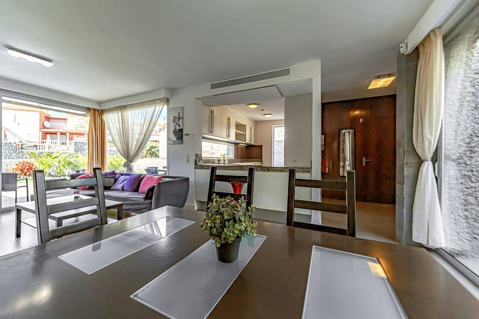 Spacious living room with TV which leads to the terrace and swimming pool