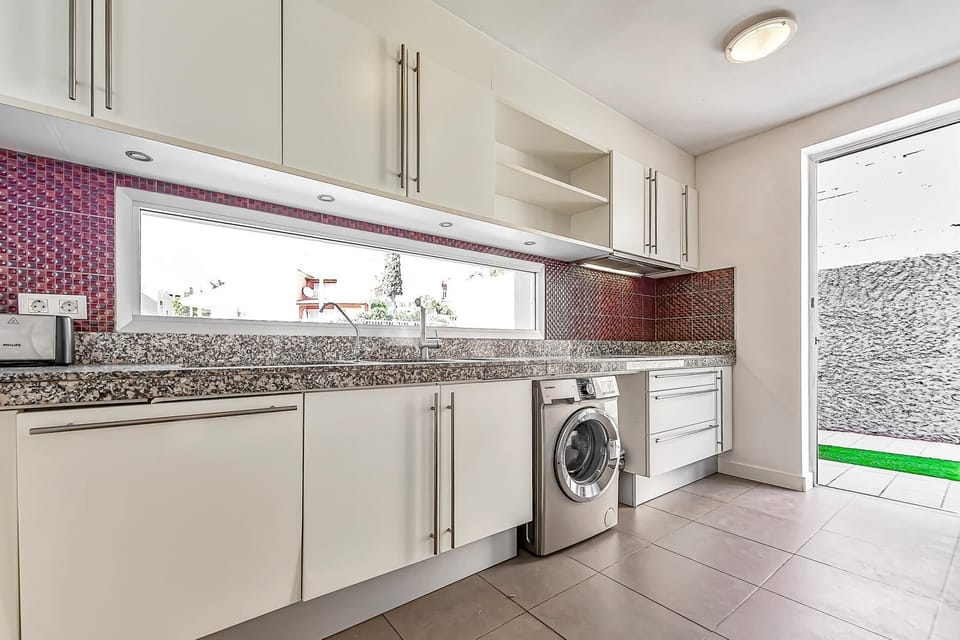 Fully equipped kitchen which leads to the terrace