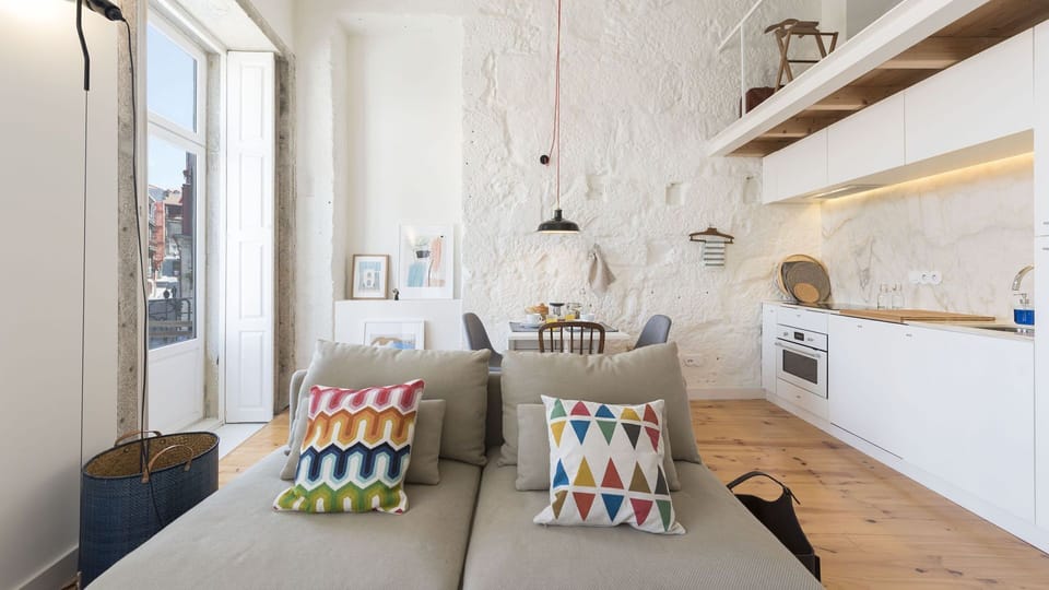 A mix of rustic and modern makes this dining area + kitchenette a unique place to start your day #porto #airbnbporto #portugal #rustic #modern