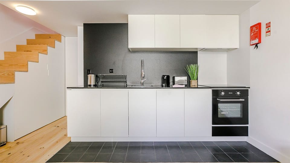 Cook, connect, and feel at home — this fully equipped kitchen is as beautiful as it is practical.

#LovelyStay #KitchenGoals #MinimalDesign #PortoStyle