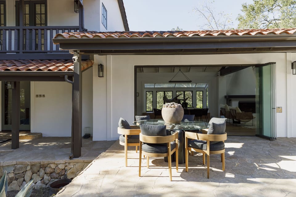 Outdoor dining/entertaining deck with BBQ, pizza oven, dining table, sofa & more