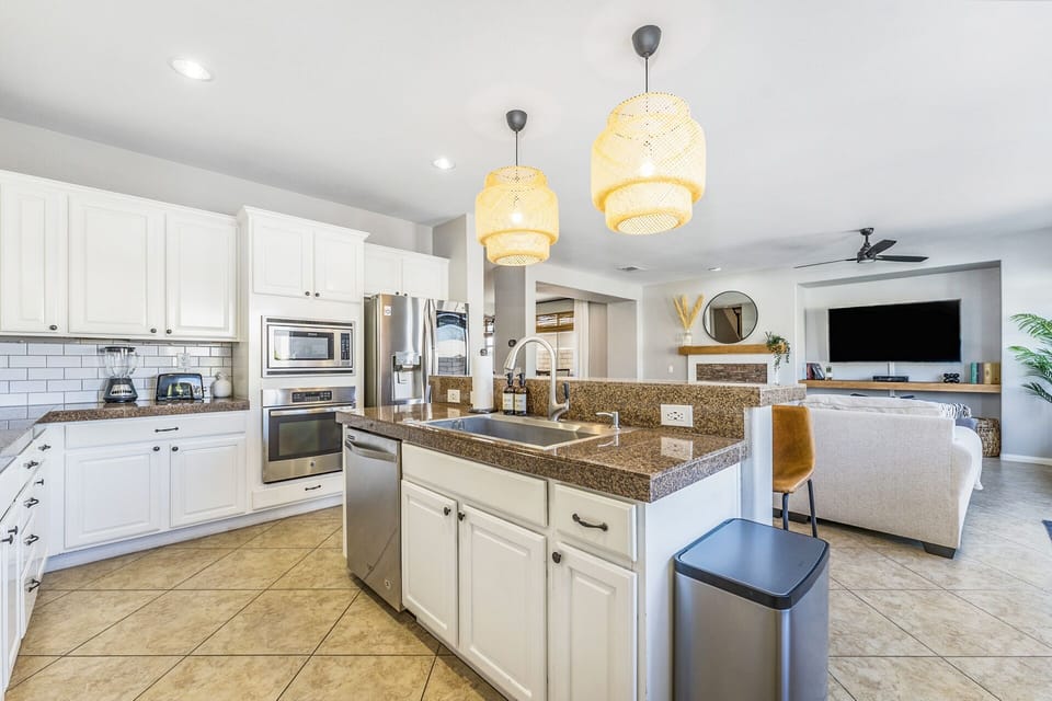 Kitchen includes toaster, oven, microwave, blender and more