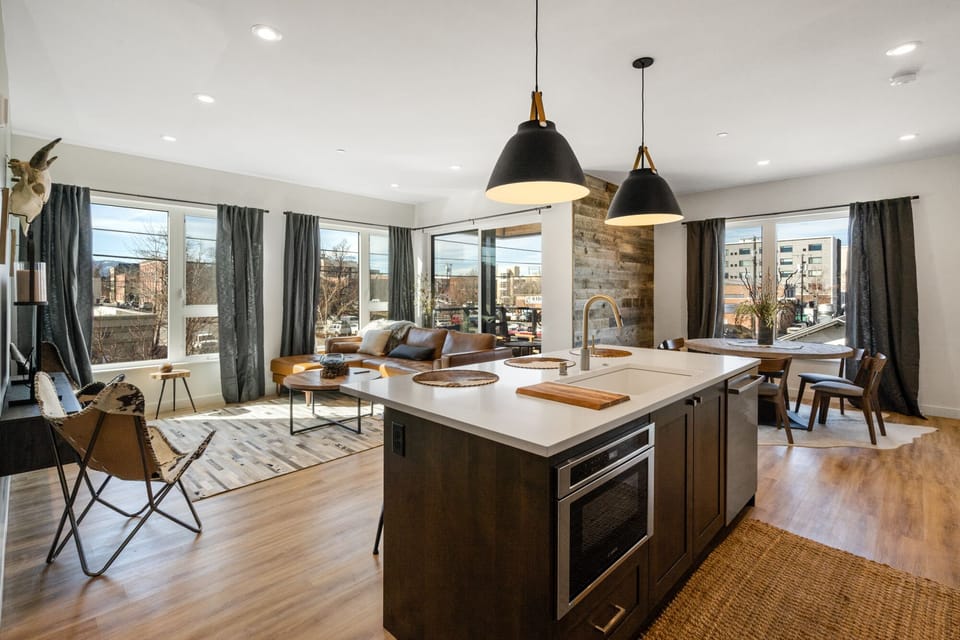 Open concept living, dining and kitchen areas.