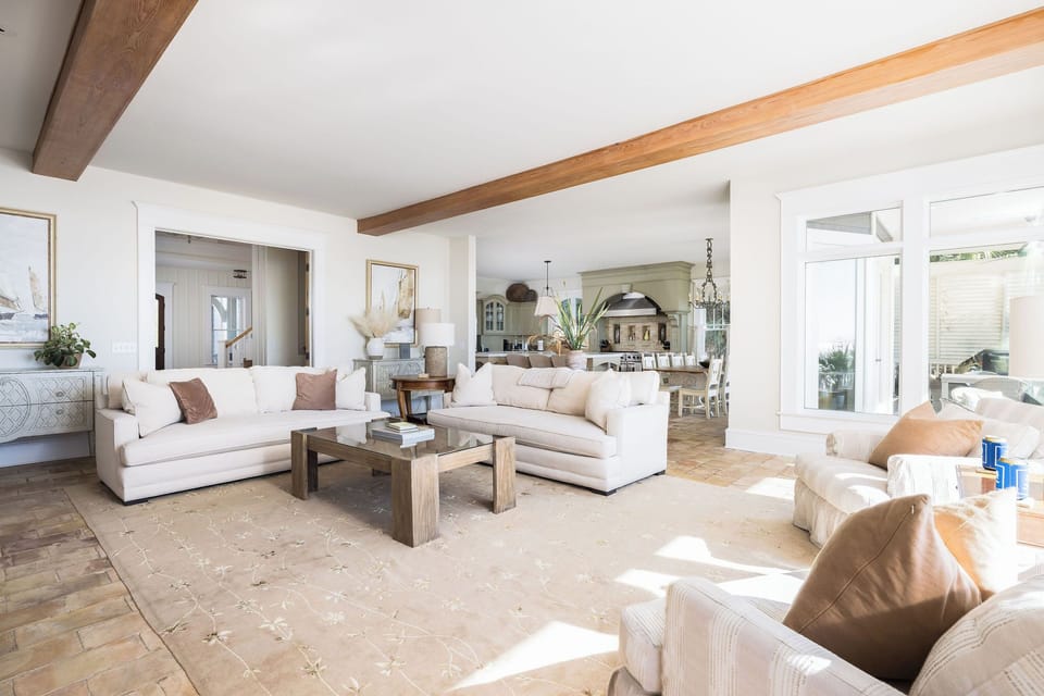 Stylish seating area with abundant sunlight and coastal charm