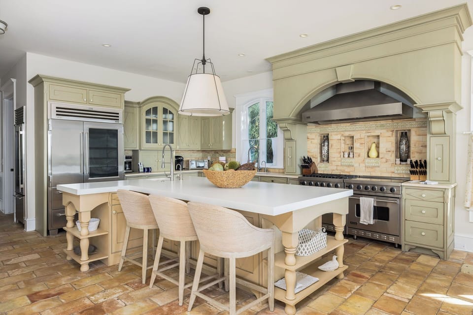 High-end kitchen featuring marble countertops and breakfast bar seating