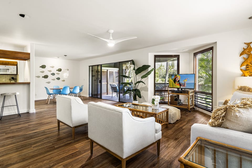Beautifully renovated living area with modern furnishings and an open-air layout filled with light.