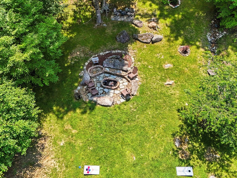 LEVEL YARD WITH FIRE PIT, CORN HOLE, AND FRISBEE GOLF GOAL, CREEKS ON EACH SIDE