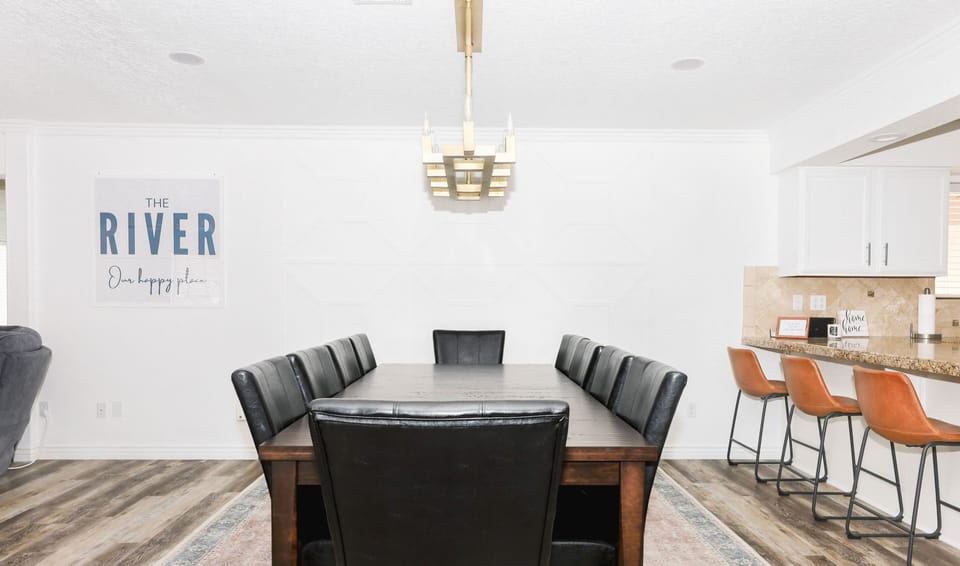 Modern dining table that seats 10, including 4 bar stools.