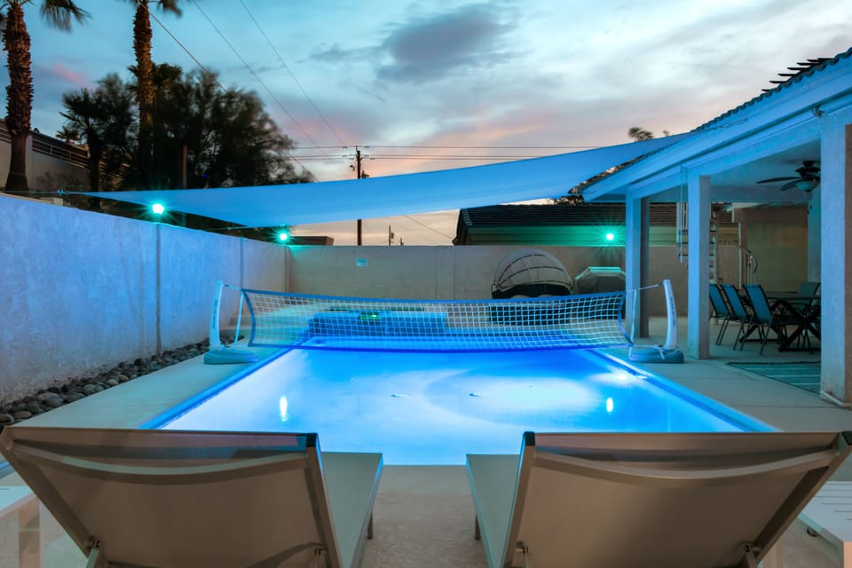 Unwind in the heated pool and spa with soft evening lights after lake days.