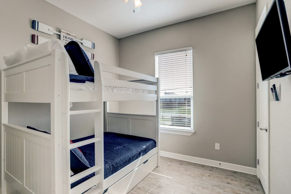 Four bedroom have a bunk bed with 2 Full size bed and 1 twin at the bottom.