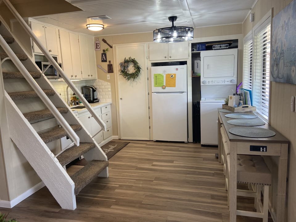 Full size oven,microwave, fridge, ironing board, washer/dryer, table, dishwasher
