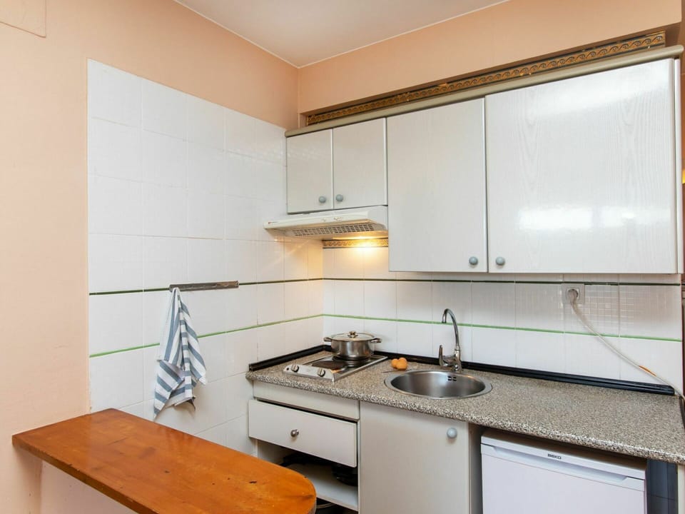 Cabinetry, Countertop, Kitchen Sink, Sink, Tap, Kitchen Appliance, Kitchen Stove, Building, Gas Stove, Interior Design