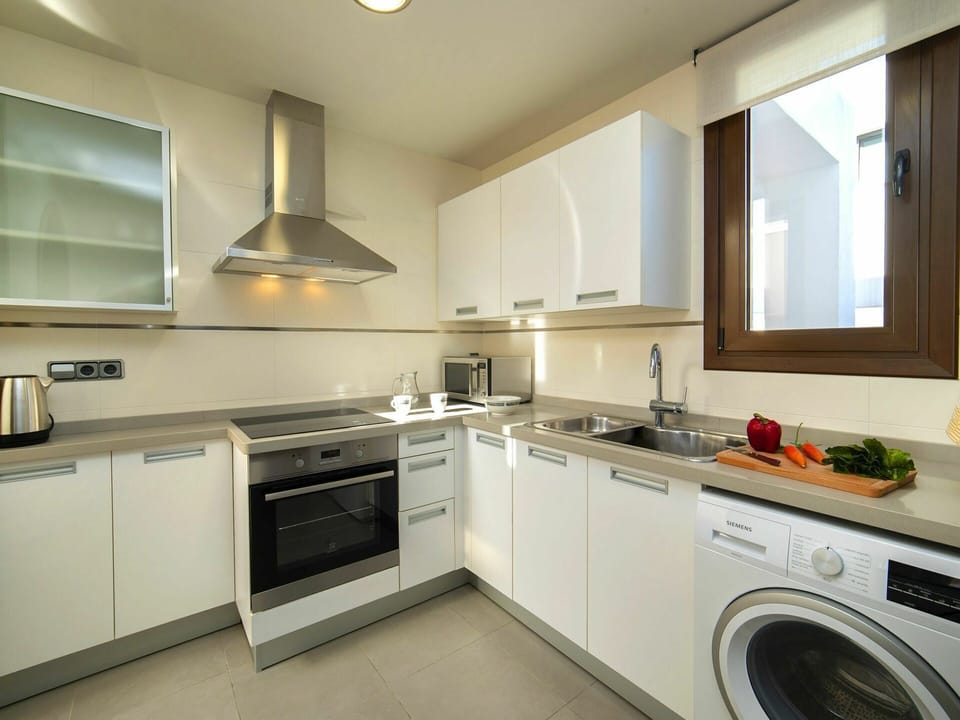 Laundry Room, Countertop, Cabinetry, Property, Washing Machine, Clothes Dryer, Tap, Kitchen Stove, Kitchen, Home Appliance
