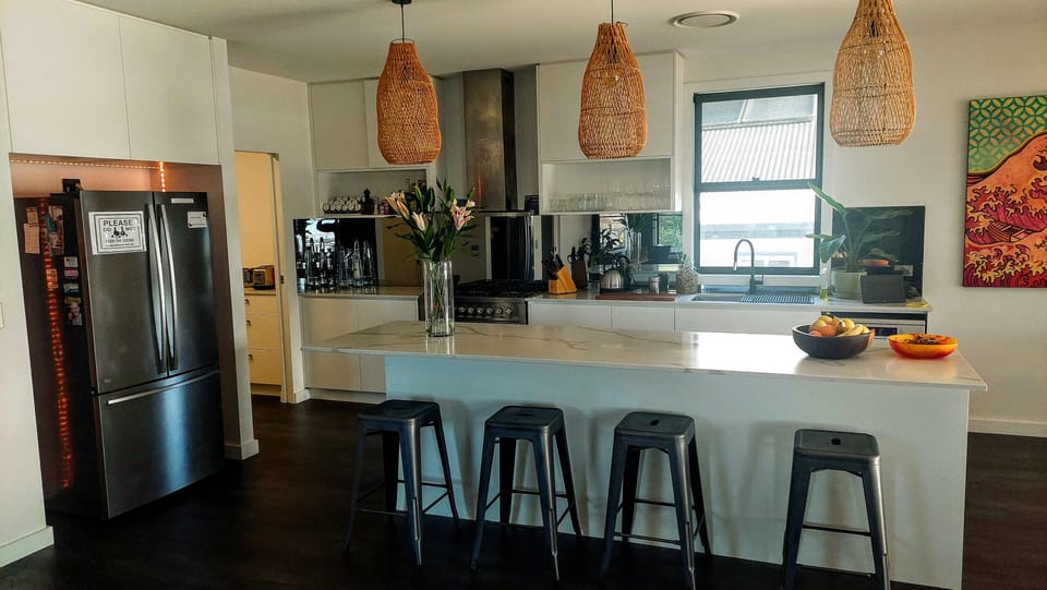 Kitchen with space for 4 stools at the kitchen island bar.