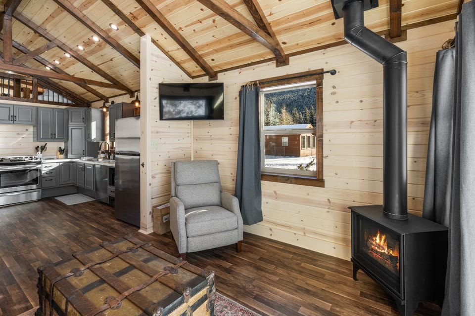 Cozy up around the gas fireplace and enjoy the views from the expansive windows.