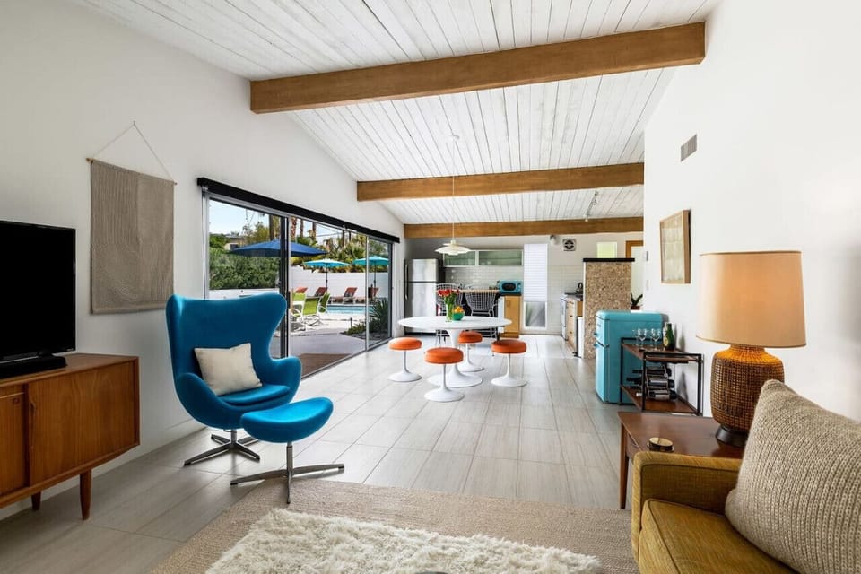 Mid-Century Sunshine & Style ☀️✨ Morning light floods this vibrant mid-century retreat, blending retro charm with modern comfort. Slide open the glass doors and step into your private poolside paradise—where relaxation begins the moment you wake up.