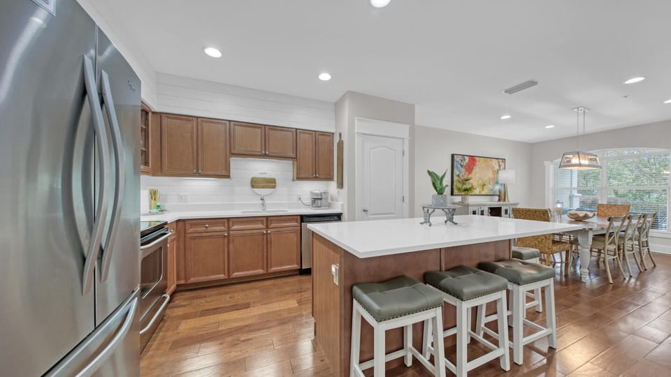 Expansive kitchen with large pantry, stainless appliances and quartz countertops