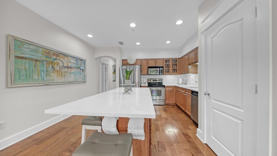 Beautiful updated white quartz oversized island and large chef’s kitchen