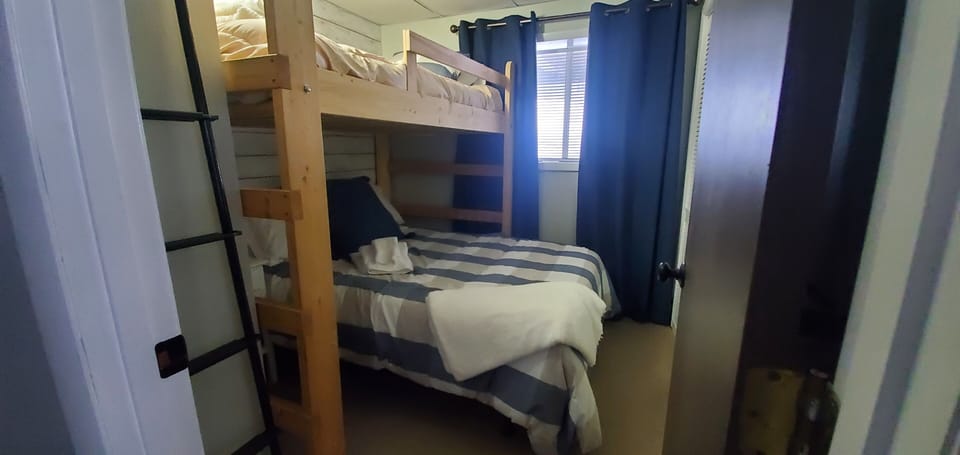 Lofted single bed with a full bed underneath