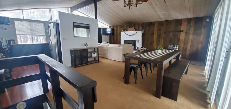 Open concept living space with large farm table for gathering 