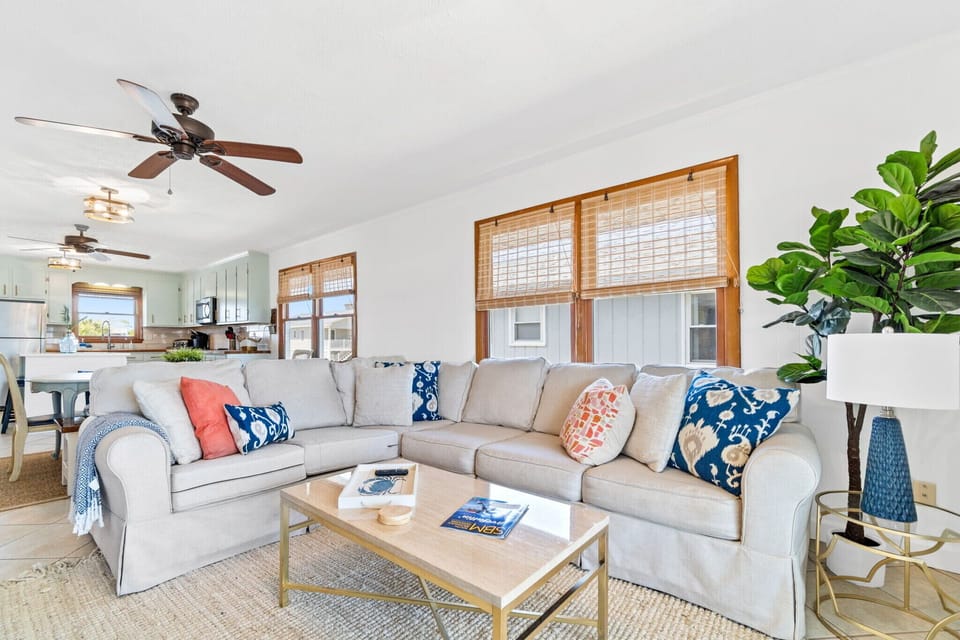 Living area with large sectional seating for family movie night 