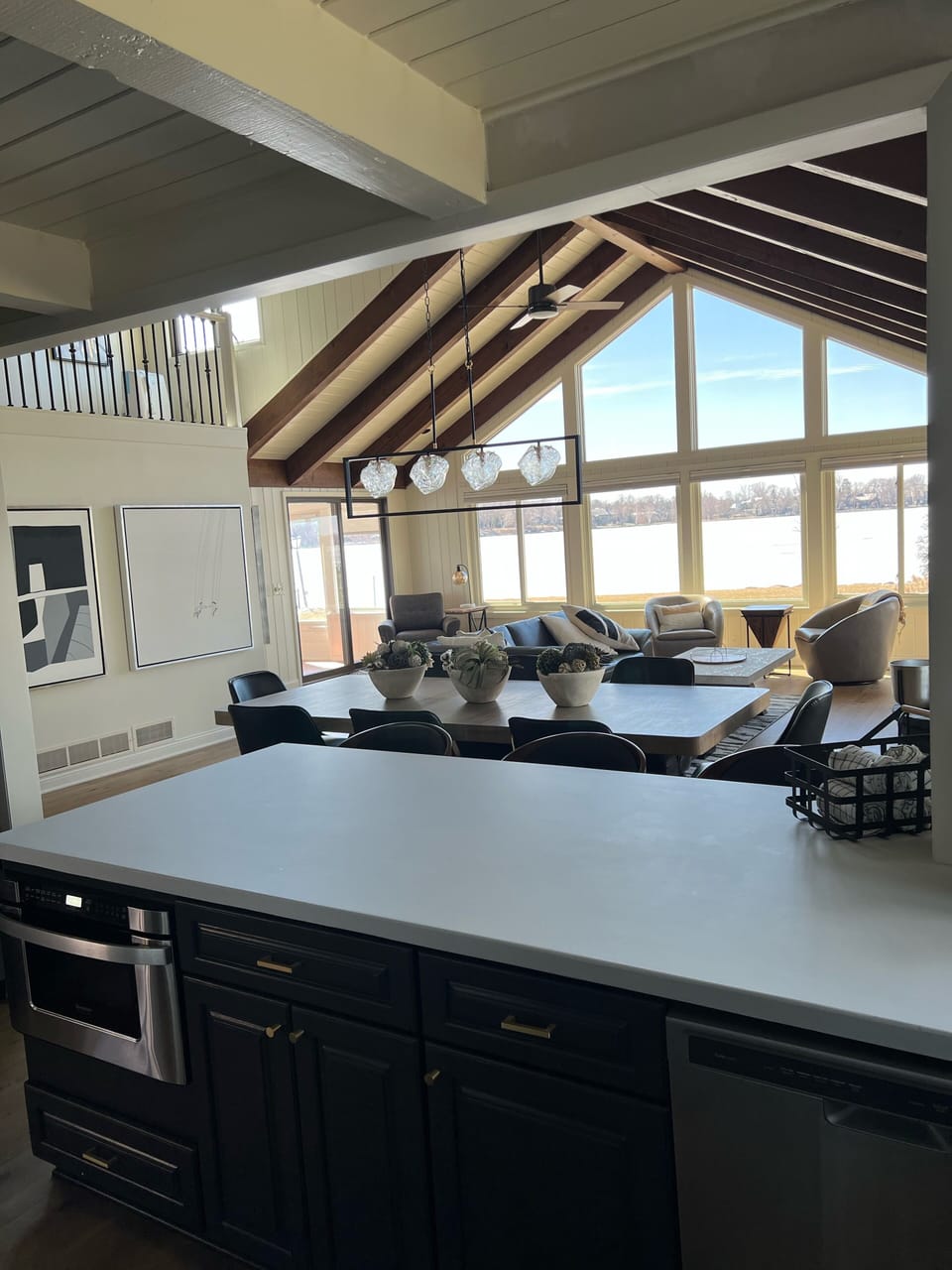 Kitchen opens up into living/dining space to enjoy views of the lake.