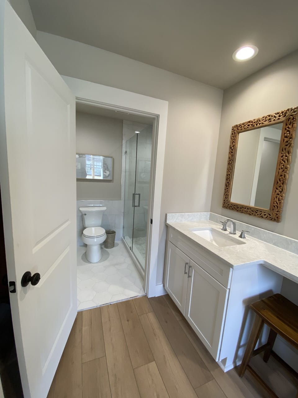 Newly renovated bathroom and walk-in tile shower.